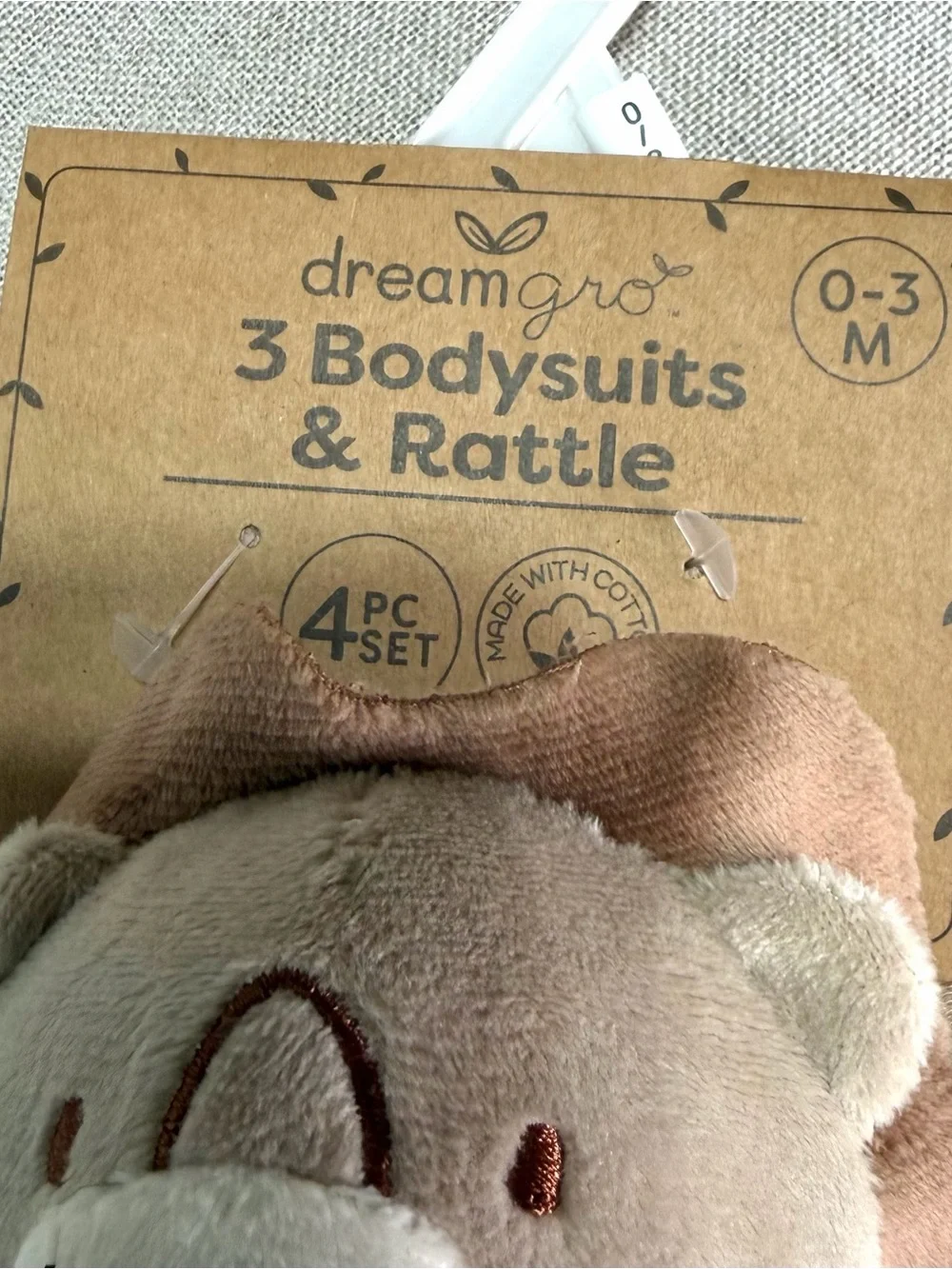 Dreamgro 3 Pack Baby One-Piece Set featuring a lion rattle